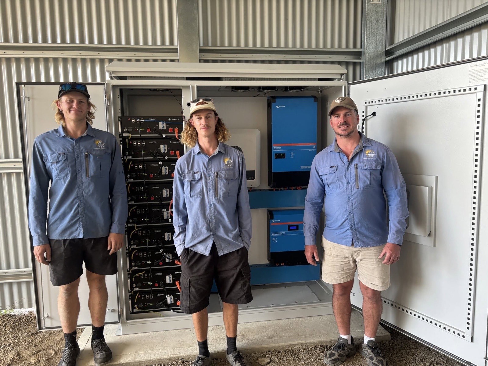 The Optimum Solar Energy team with a custom off-grid cabinet build in Whetstone